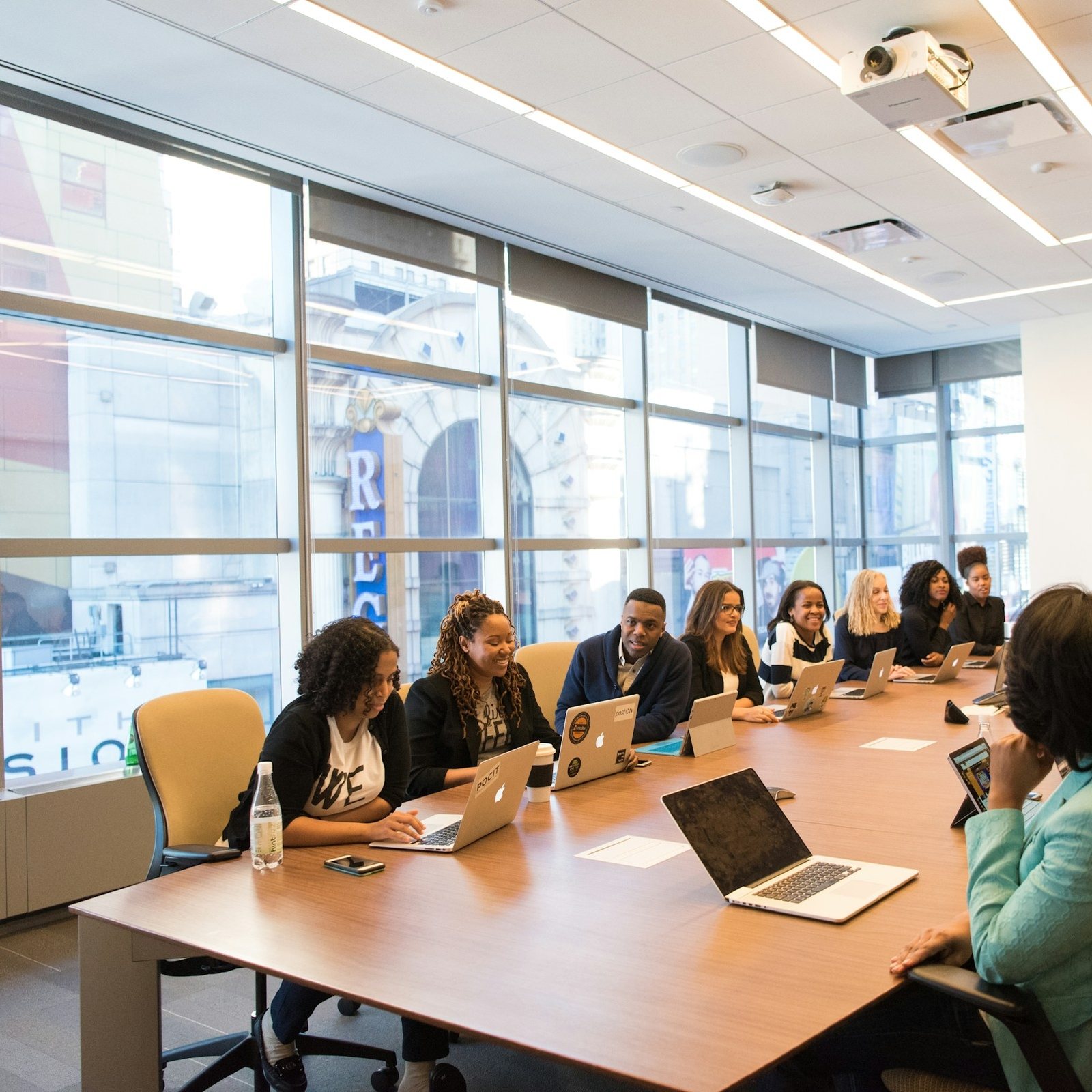 A full boardroom table during a working meeting